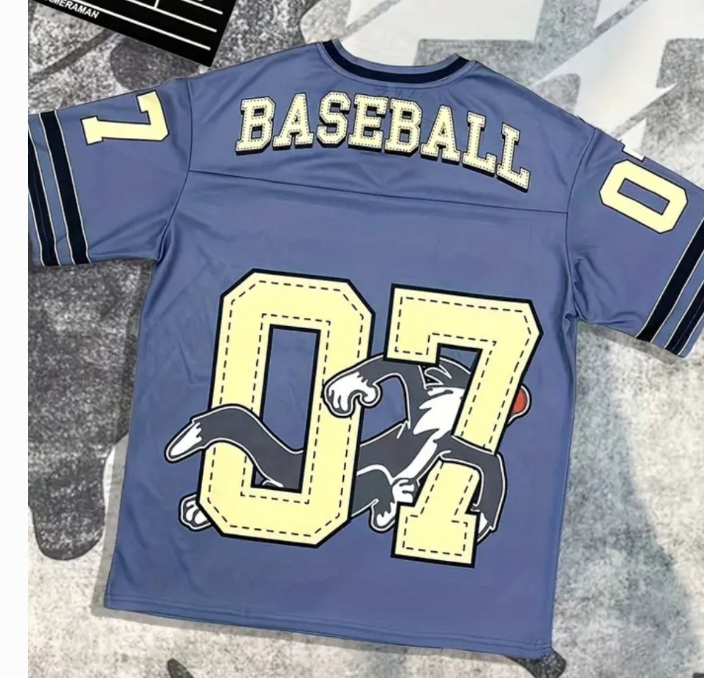 Blue oversized unisex jersey featuring the number 07 and baseball graphics on the back.
