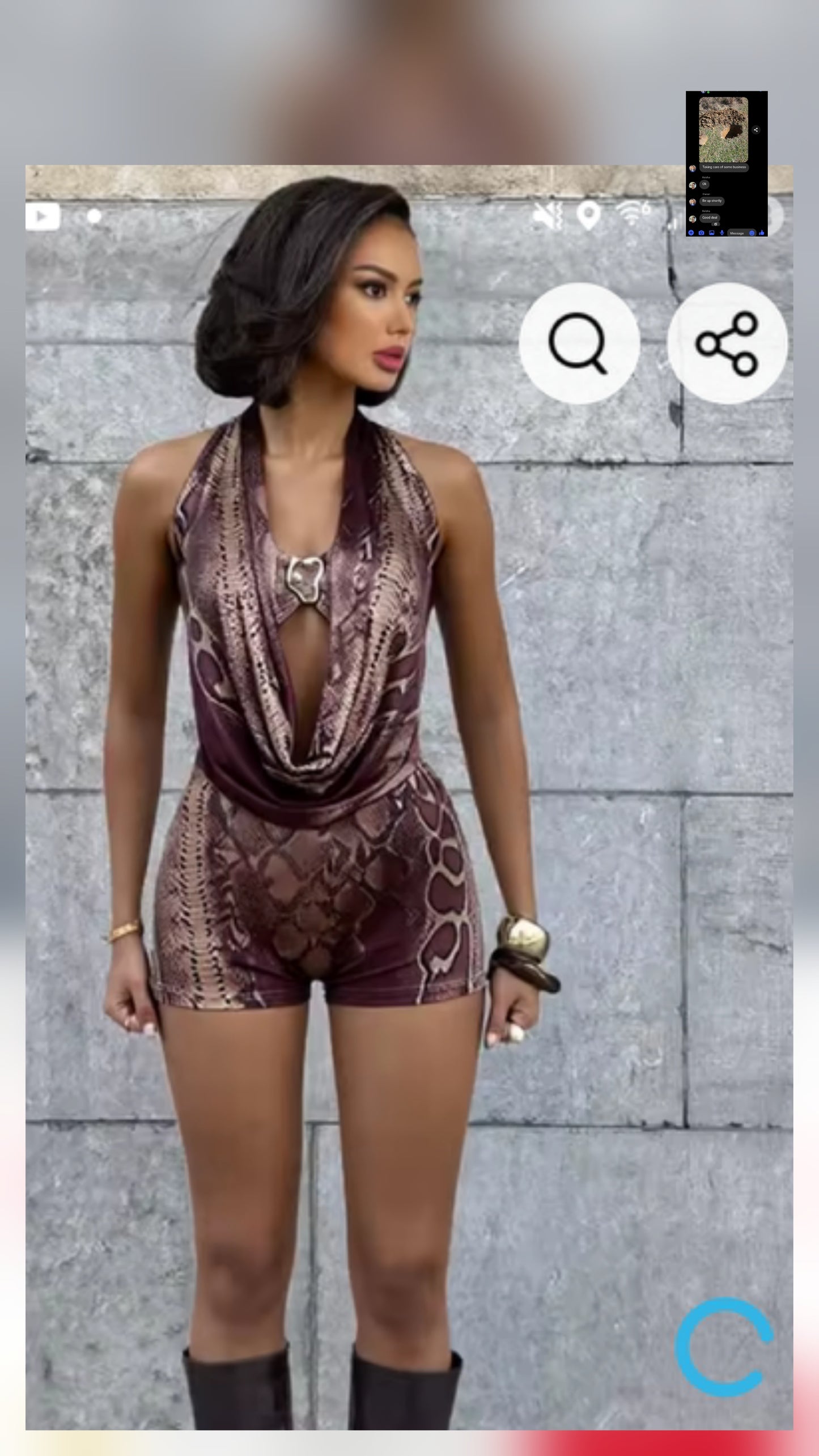 Classy romper with gold detail worn by model against a stylish, textured background.