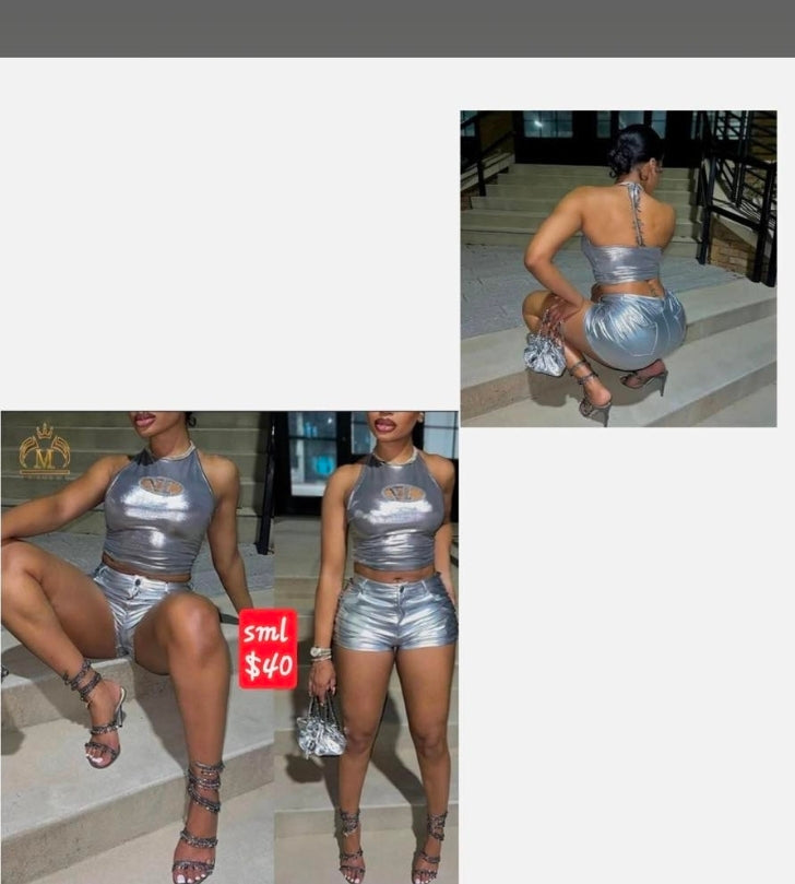 Model wearing stylish silver faux leather outfit, showcasing trendy shorts and halter top, priced at $40.