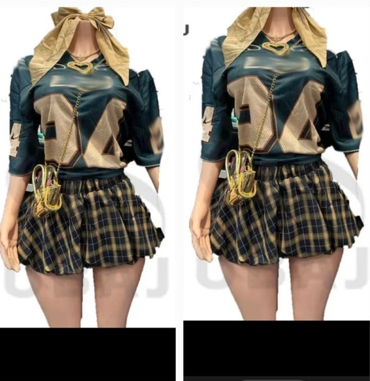 Model showcasing a trendy Jersey Plaid Skirt Set featuring a stylish top and plaid skirt set design.