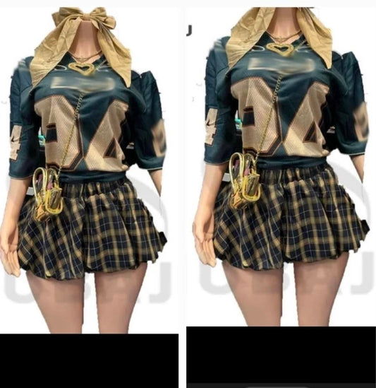 Model showcasing a trendy Jersey Plaid Skirt Set featuring a stylish top and plaid skirt set design.
