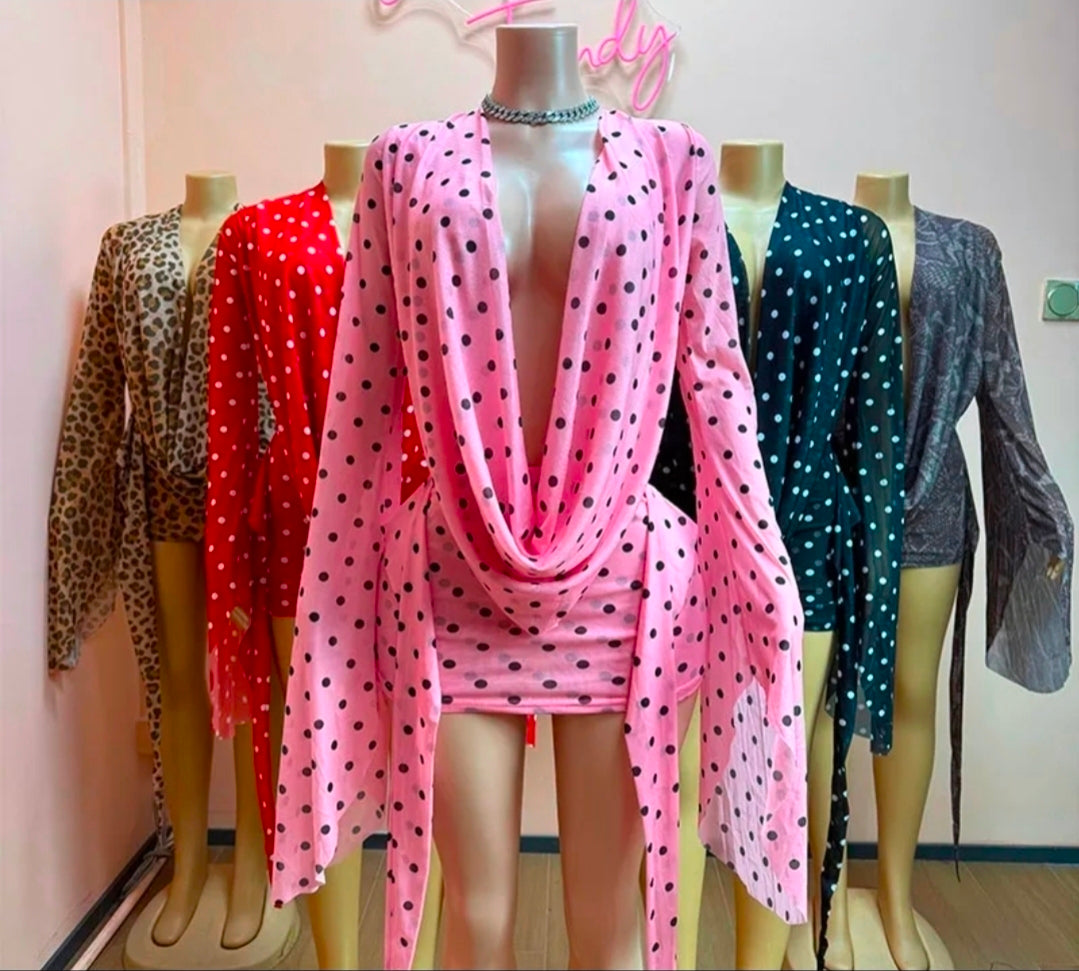 Mesh dress with bell sleeves in various colors and patterns displayed on mannequins.